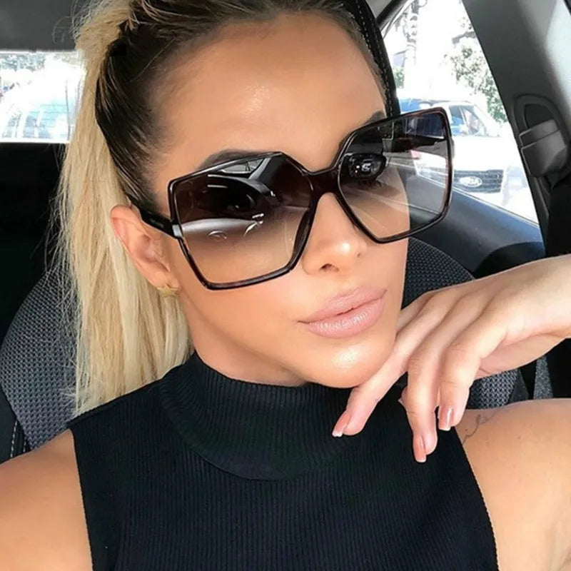 Fashion women's oversize sunglasses by Showlu with gradient plastic frames and UV400 protection, stylish and trendy sun glasses.