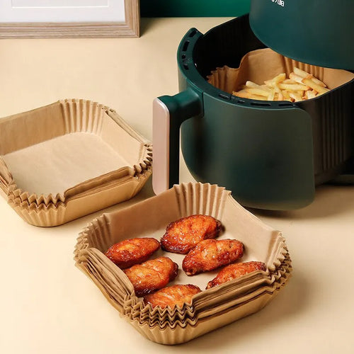 Set of 50 disposable parchment paper liners for air fryers, made of wood pulp, ideal for steaming and baking cheesecake.
