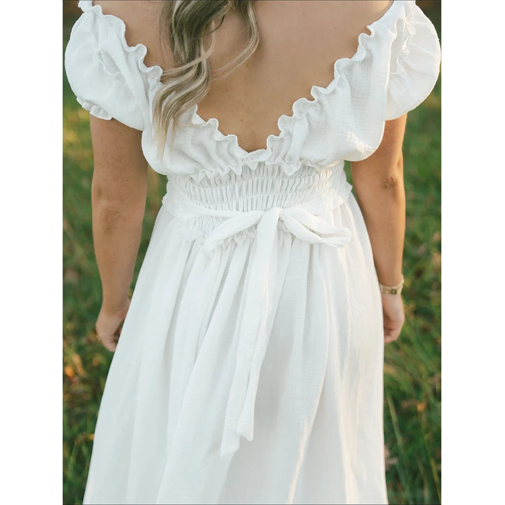 Showlu Bohemian maternity maxi gown with off-shoulder ruffles, perfect for photoshoots and special occasions.