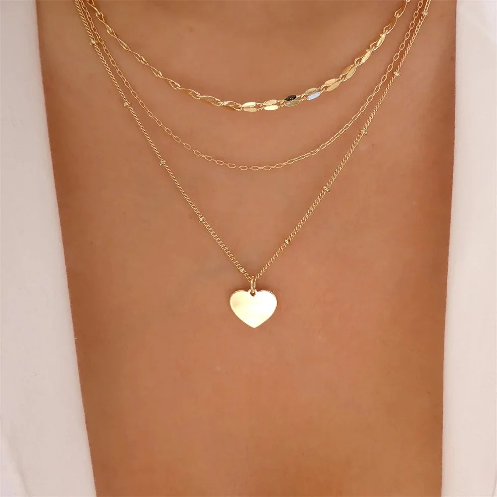 Elegant vintage pearl necklace for women with layered gold chain and round pendant, fashionable jewelry for girls and women