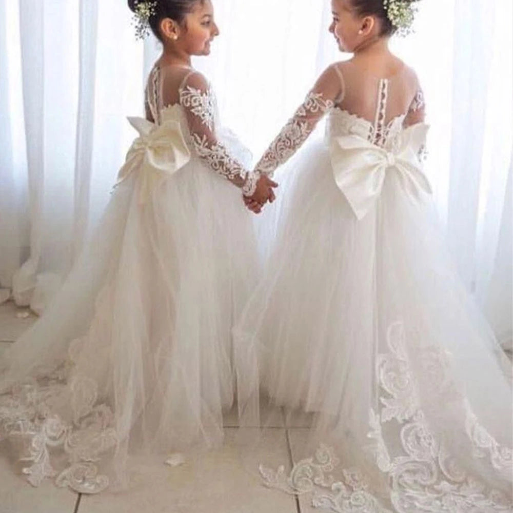Baby girl lace flower girl dress by Showlu Fashion Store featuring floral lace, a bow, and long sleeves, perfect for special occasions.