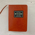 Brown leather men's prayer journal, Showlu One Minute With God, featuring 365 daily pages for prayer and reflection.