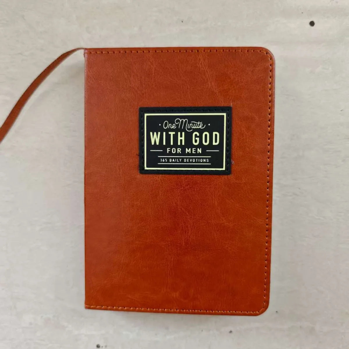Brown leather men's prayer journal, Showlu One Minute With God, featuring 365 daily pages for prayer and reflection.