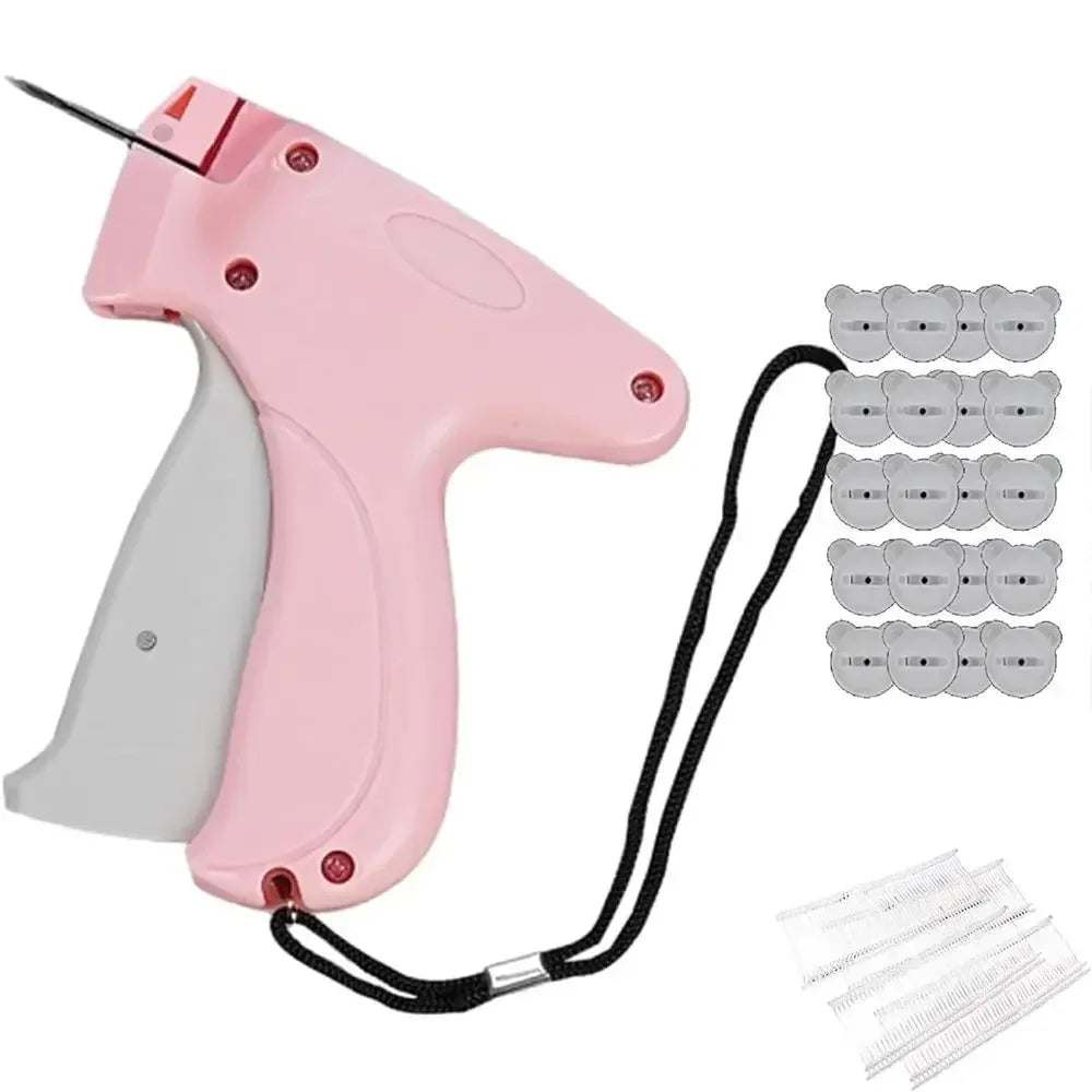 SHOWLU Portable Quick Clothing Fixer and Micro Stitch Tag Gun for clothes, shown in a close-up with the device in hand.