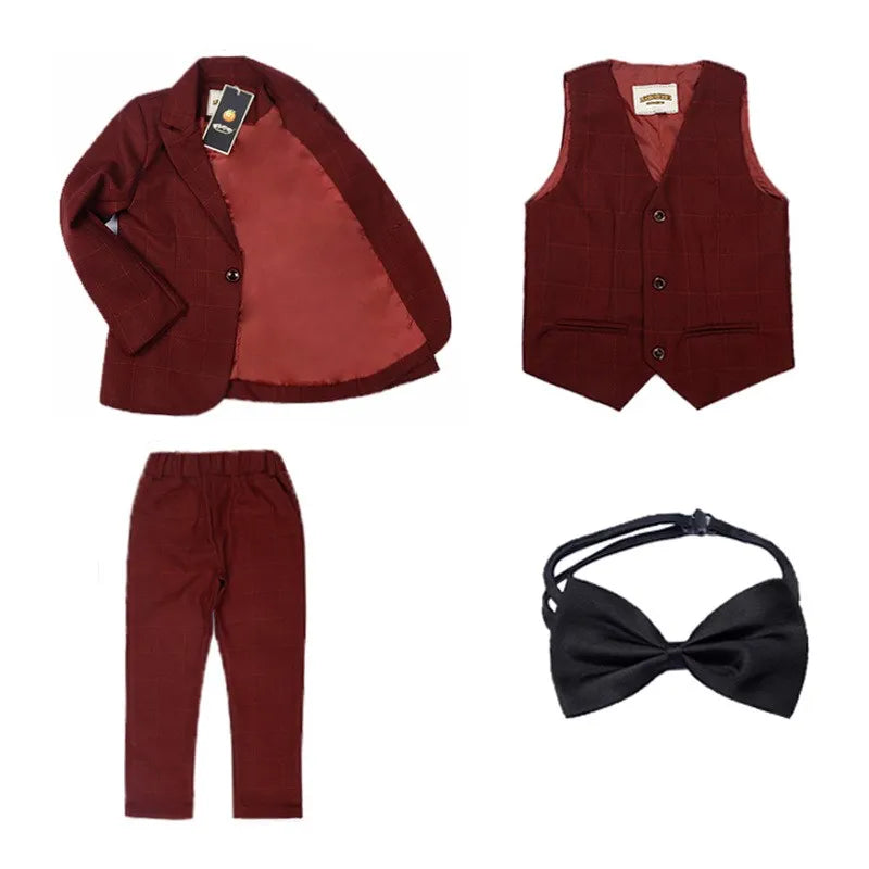 Dark green boys' formal wedding suit and tuxedo set by SHOWLU FASHION STORE, includes jacket, vest, pants, and tie.