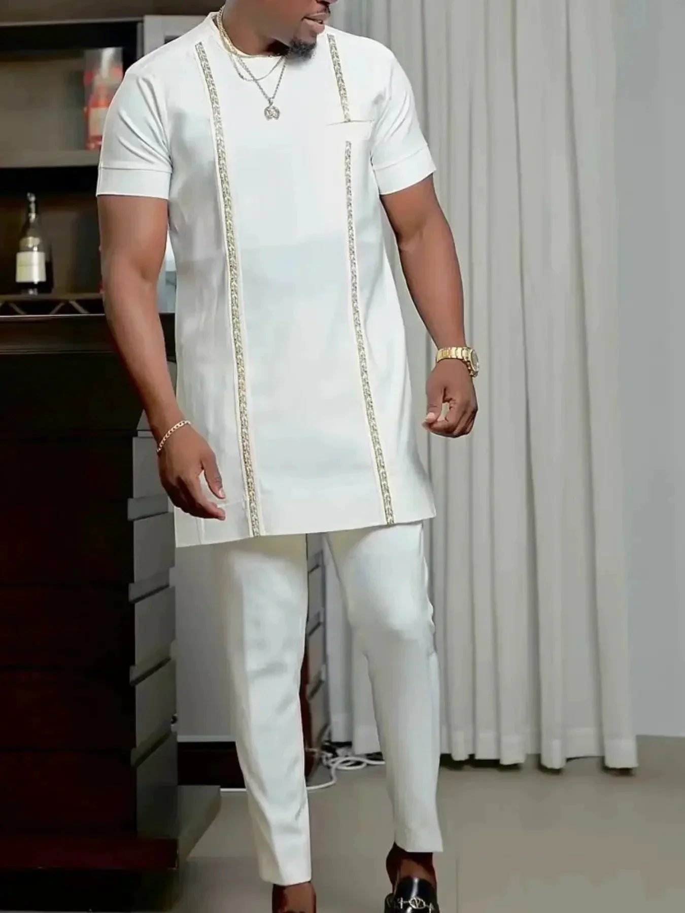 SHOWLU Men's African Kaftan Tracksuit in embroidered 2-piece set, featuring traditional design and vibrant fabric details.