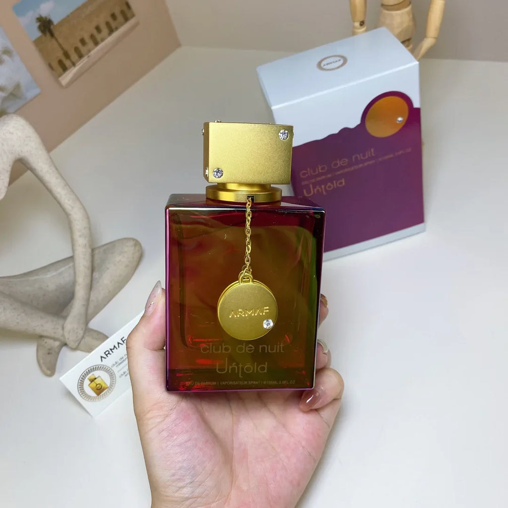 Unisex Armaf Club De Nuit Intense perfume bottle with Oriental Woody scent, 3.6oz, featuring sleek design and elegant packaging.