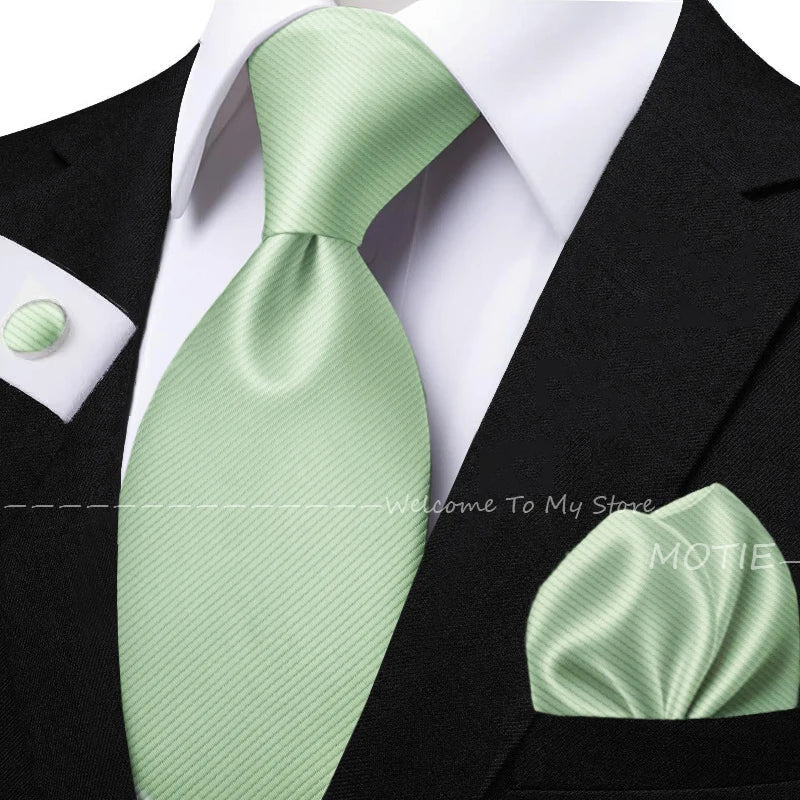 Men's sage green tie set with pocket square, flower brooch, cufflinks, and collar accessory for wedding or daily wear.