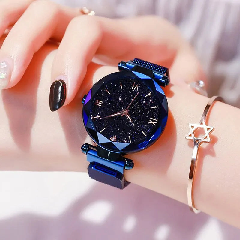 Women's fashion starry sky watch with diamond accents, mesh band, magnet buckle, quartz movement, suitable for dressy occasions.