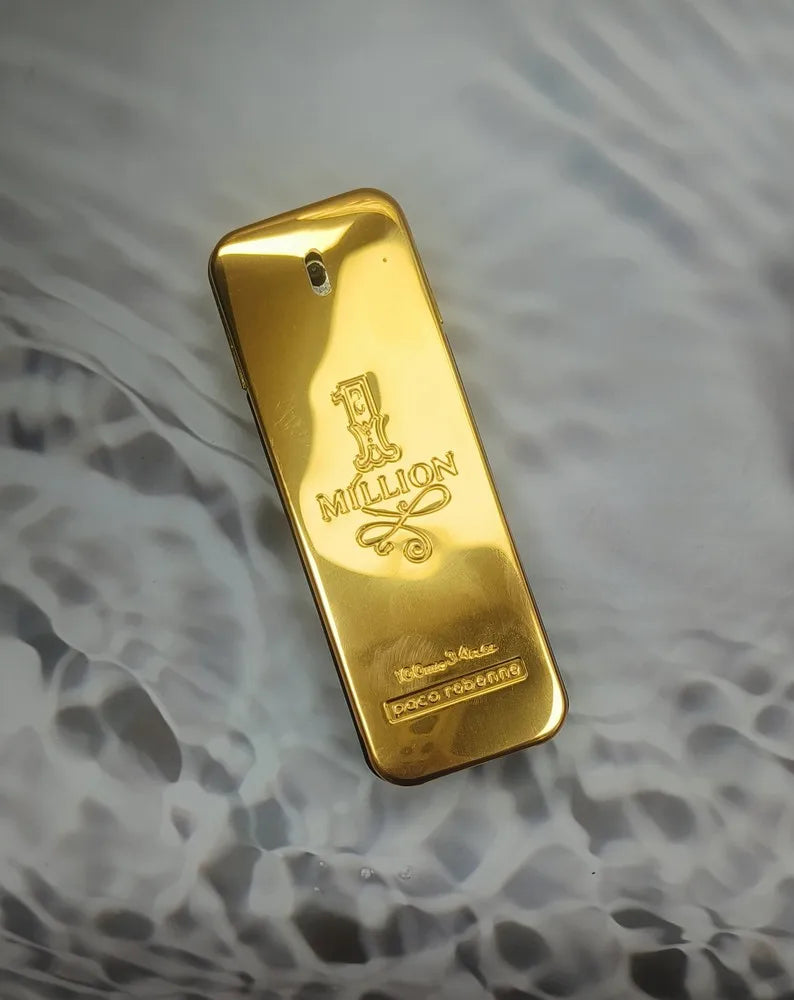 Paco Rabanne 1 Million men's Eau De Toilette bottle, 3.4 oz / 100 ml, sleek gold packaging on a white background