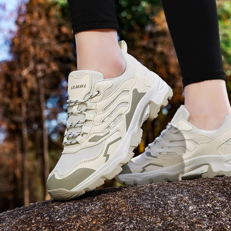 Unisex 2025 waterproof hiking shoes with non-slip soles, ideal for outdoor sports and camping, showing rugged tread and durable material.