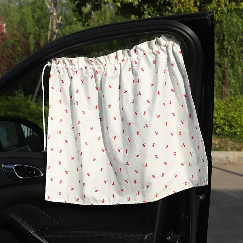 Showlu Smart General baby car window shade protecting against sunlight, with mesh design for visibility inside the vehicle.