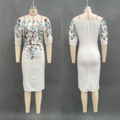 A white knee-length sheath dress with a floral print, slash neckline, and lantern sleeves.