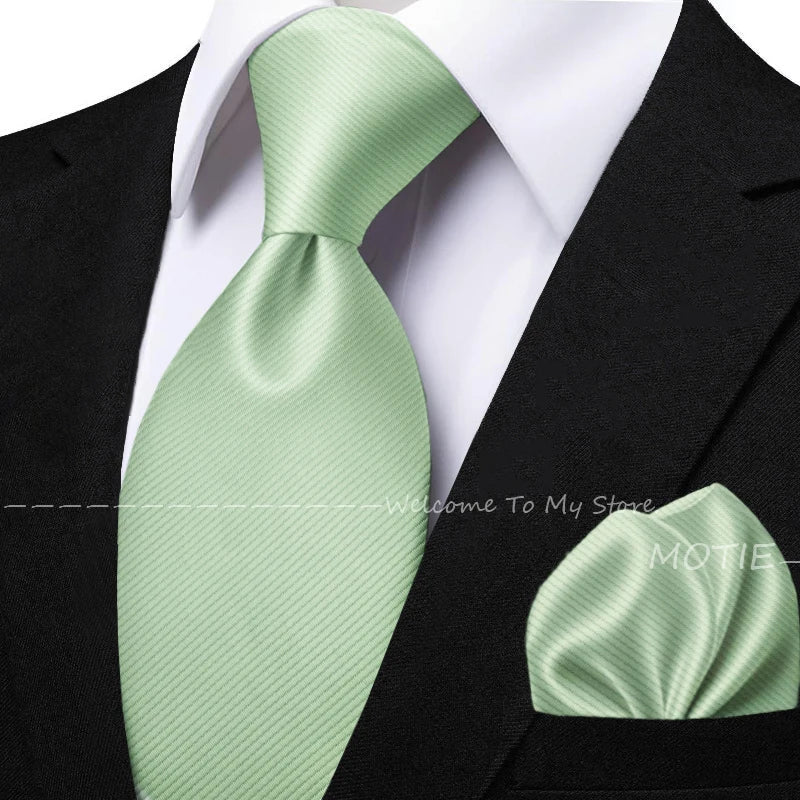Men's sage green tie set with pocket square, flower brooch, and cufflinks, perfect for wedding or daily wear accessories.