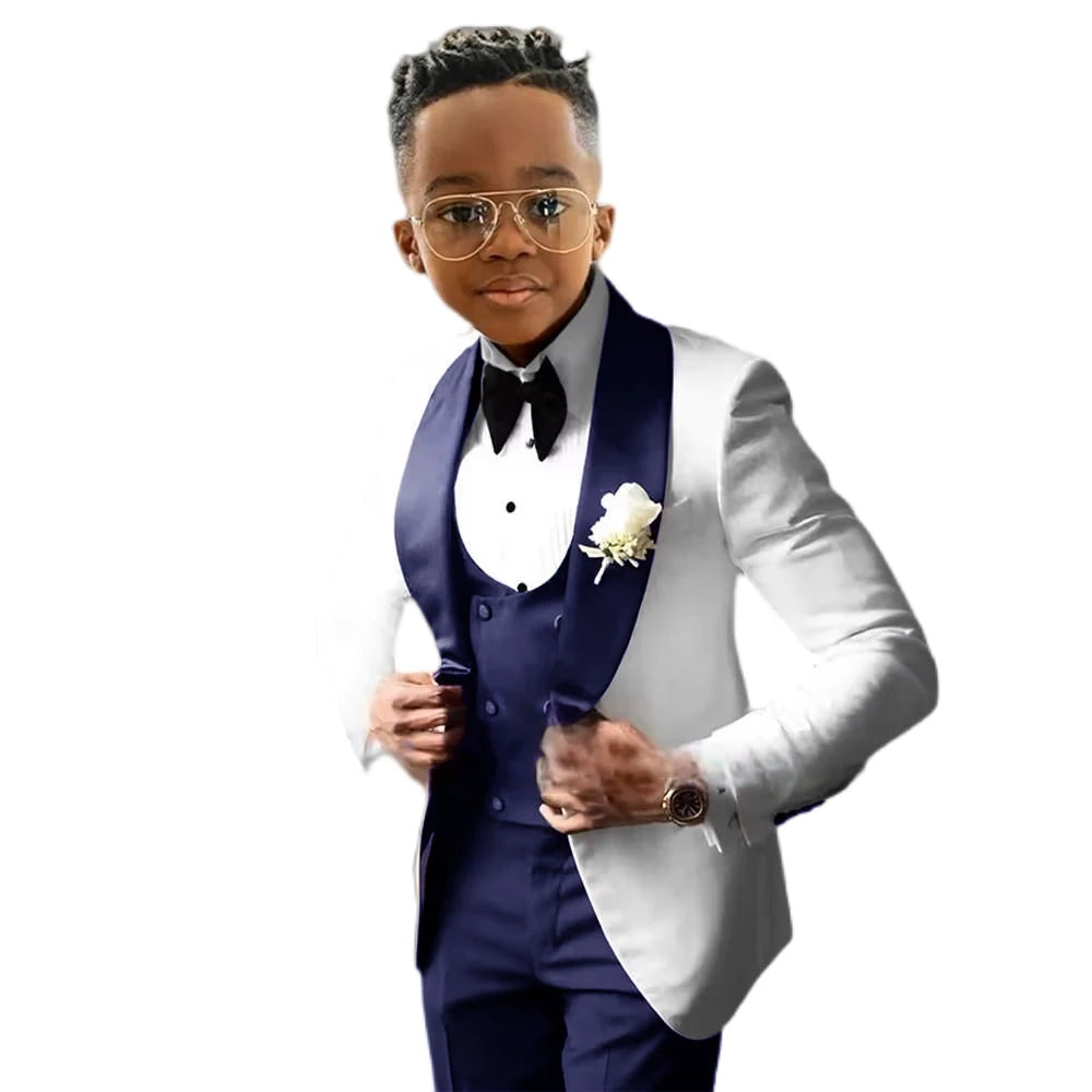Boy's wedding tuxedo suit with white jacket, royal blue pants, and vest, slim fit tailored 3-piece blazer set.