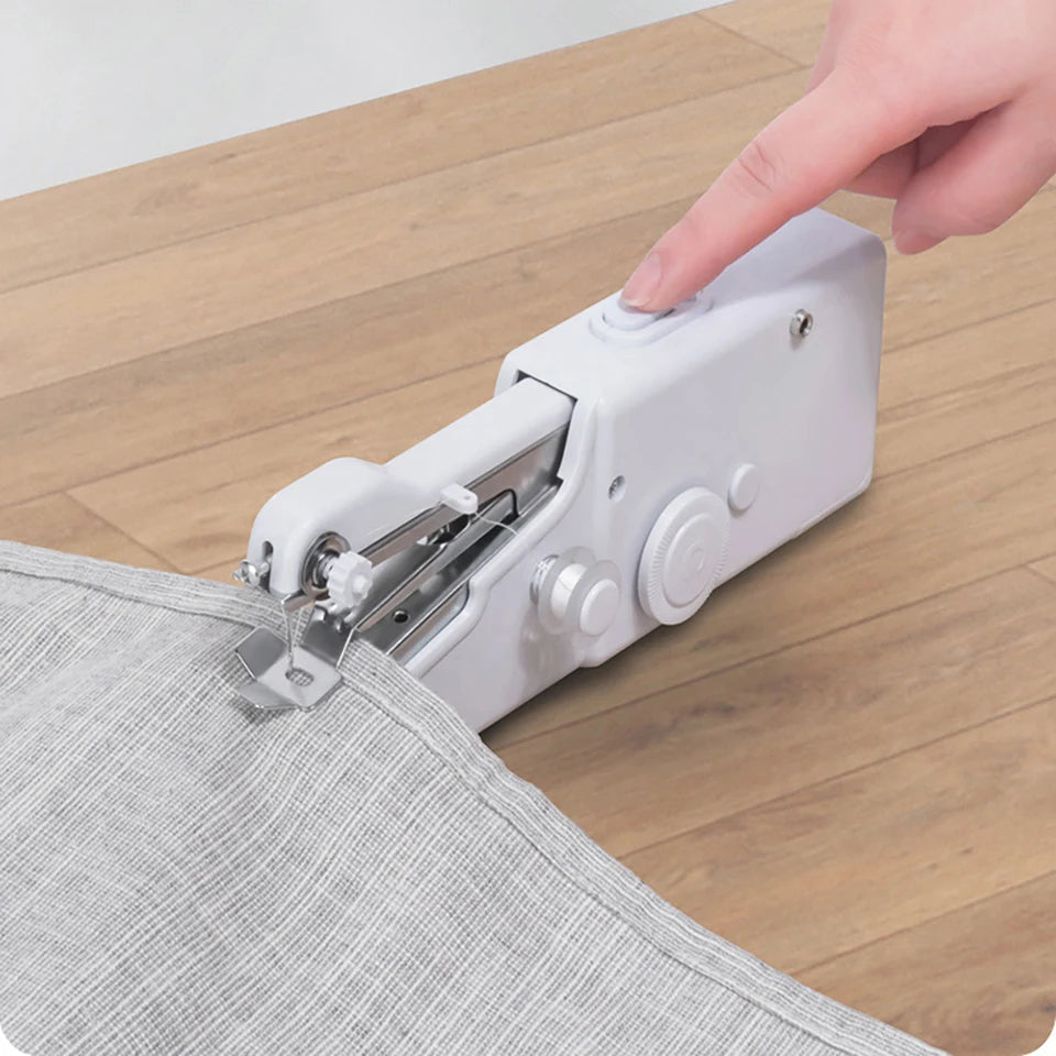Showlu Smart General Mini Handheld Sewing Machine, compact and portable device with controls and fabric in use.