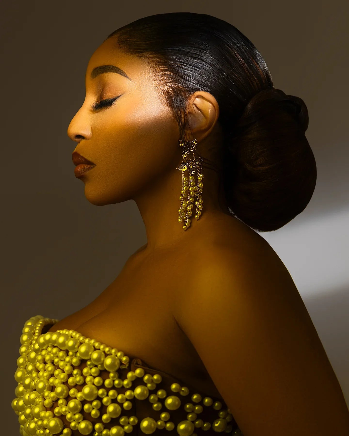 Elegant African wedding prom dress by Showlu Fashion with big floral design, luxury pearls, beads, and rose accents.