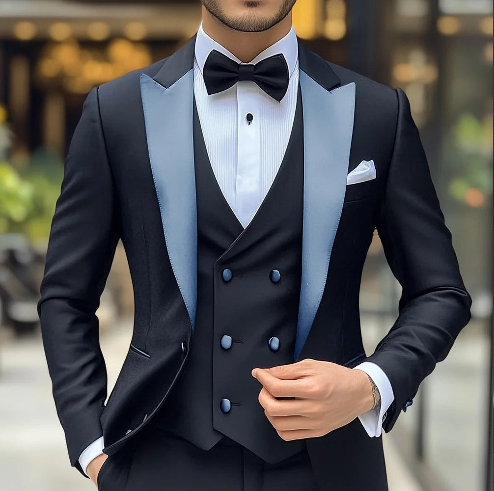 Black men's groom wedding tuxedo 3-piece suit with jacket, vest, and pants, featuring peak lapel and slim fit style.