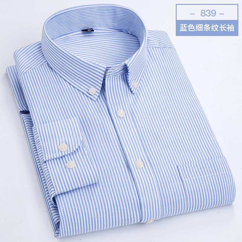 Slim fit Showlu men's oxford shirt with long sleeves, non-iron casual top in classic blue fabric, shown on a hanger.