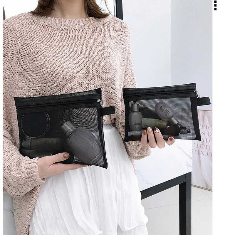 Black transparent Showlu Fashion Store makeup bag with mesh design, small and large sizes, ideal for cosmetics and pencil storage.