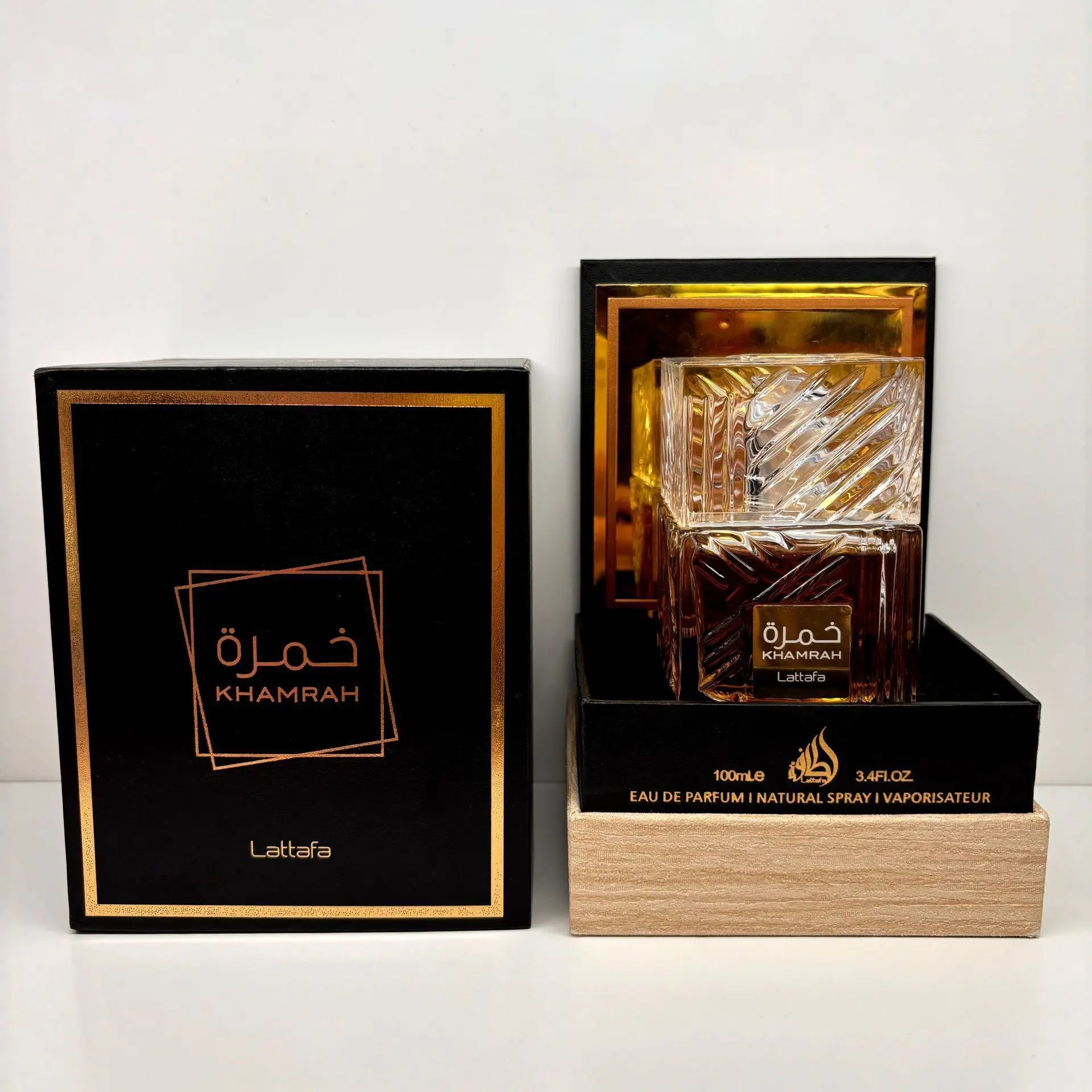 Lattafa Khamrah unisex perfume spray with warm vanilla and cinnamon scent, 100ml bottle, shown in sleek packaging