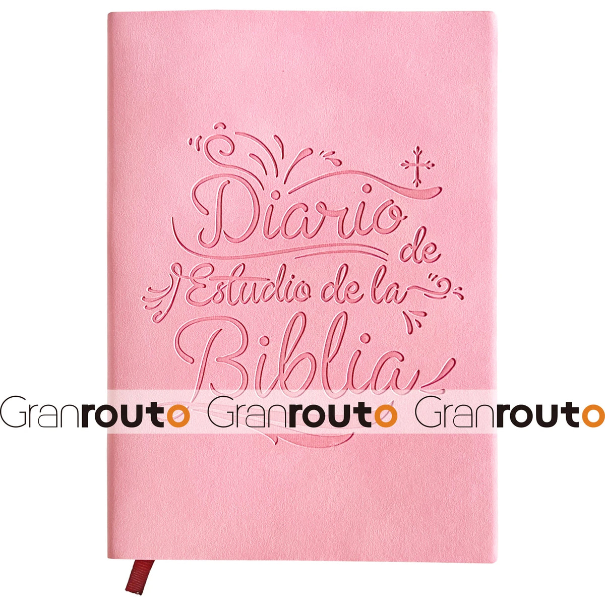 A pink Bible study journal with embossed Spanish text on the cover and a red ribbon bookmark.