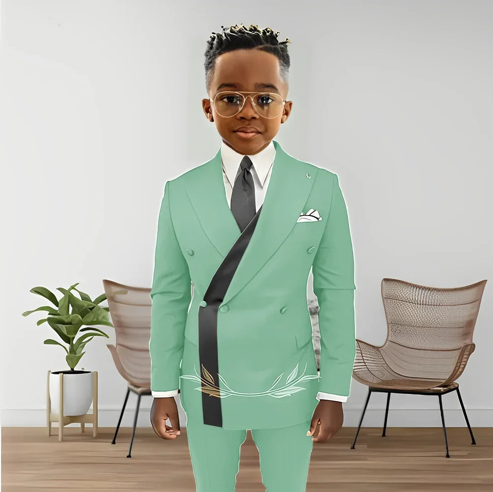 Boy wearing Showlu Fashion double-breasted blazer and pants tuxedo set, perfect for kids' wedding or formal events.