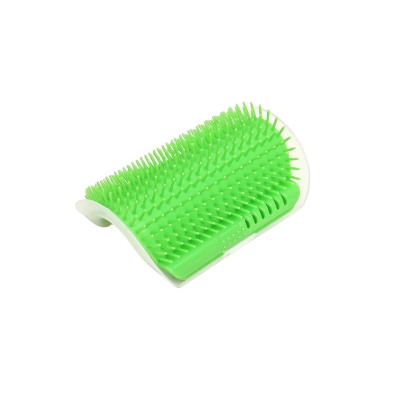 Showlu Fashion Store cat scratcher massager with grooming brush and hair removal comb for cats and kittens on a grooming table.