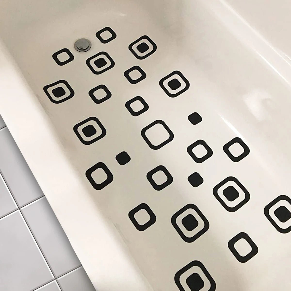 Showlu Smart General anti-slip bath stickers on a bathtub surface, providing safety and traction in wet conditions.