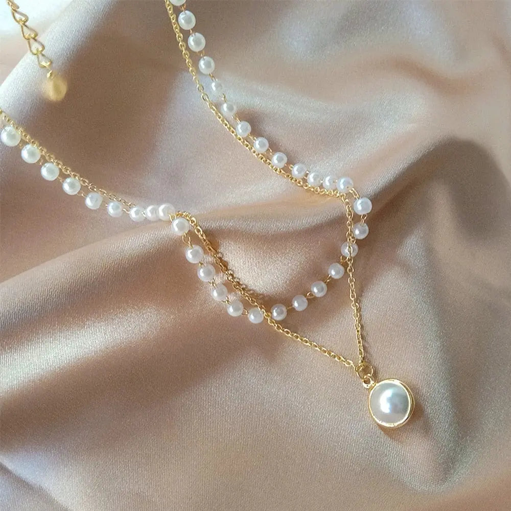 Sumeng Pearl Choker Necklace with double-layer chain and pendant, stylish jewelry for women, featuring white pearls and delicate design.