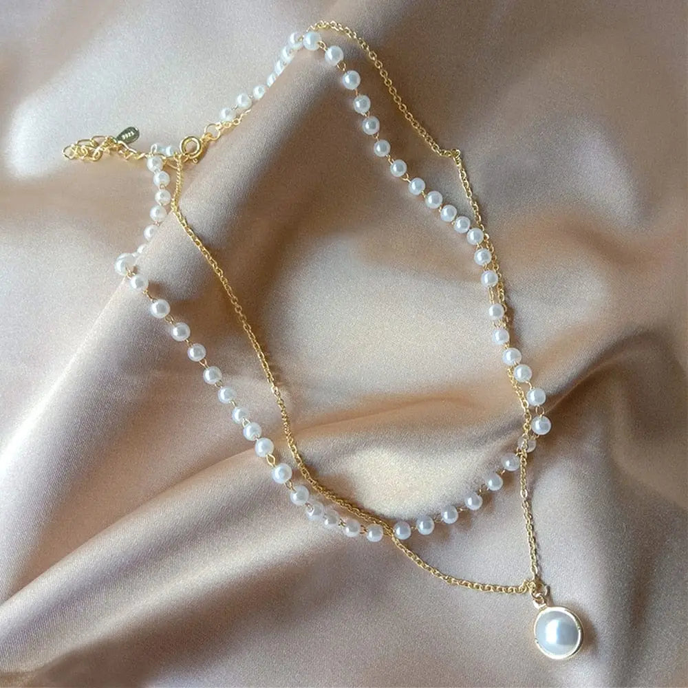 Pearl choker necklace by Showlu Fashion with double-layer chain and pendant, stylish jewelry for women.