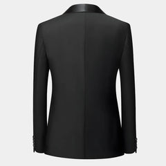 The back view of a black men's suit jacket featuring a satin lapel and buttoned cuffs.