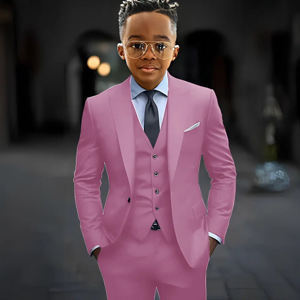 Dark grey high-quality boy suit featuring a slim fit, single-breasted jacket, peak lapel, matching pants, and vest for kids.