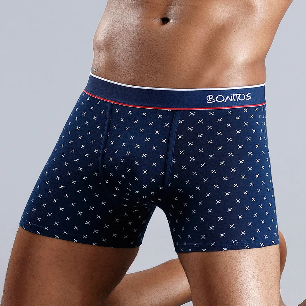 Men's cotton print boxer shorts by Showlu Fashion Store, featuring soft knit fabric and vibrant pattern, shown on a model.