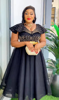 Elegant Dromiya women's rhinestone A-line evening gown with short sleeves and V-neck, featuring a stylish design and shimmering details.