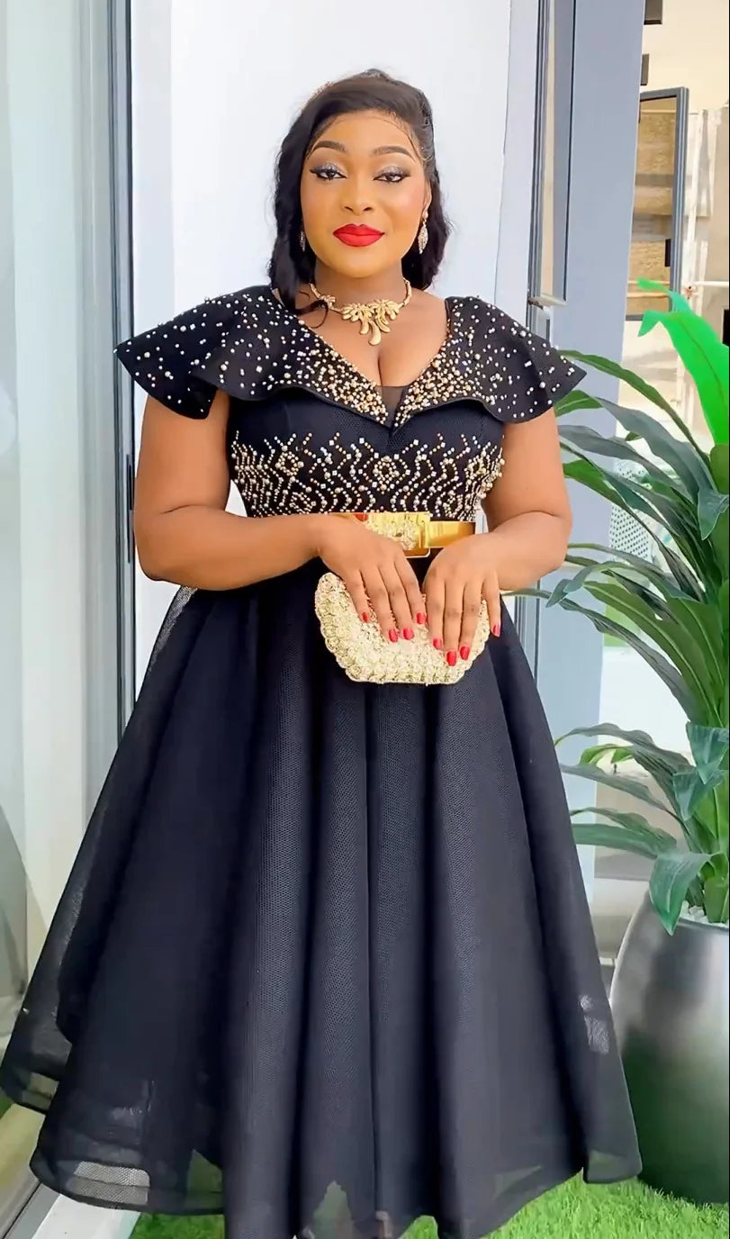 Elegant Dromiya women's rhinestone A-line evening gown with short sleeves and V-neck, featuring a stylish design and shimmering details.
