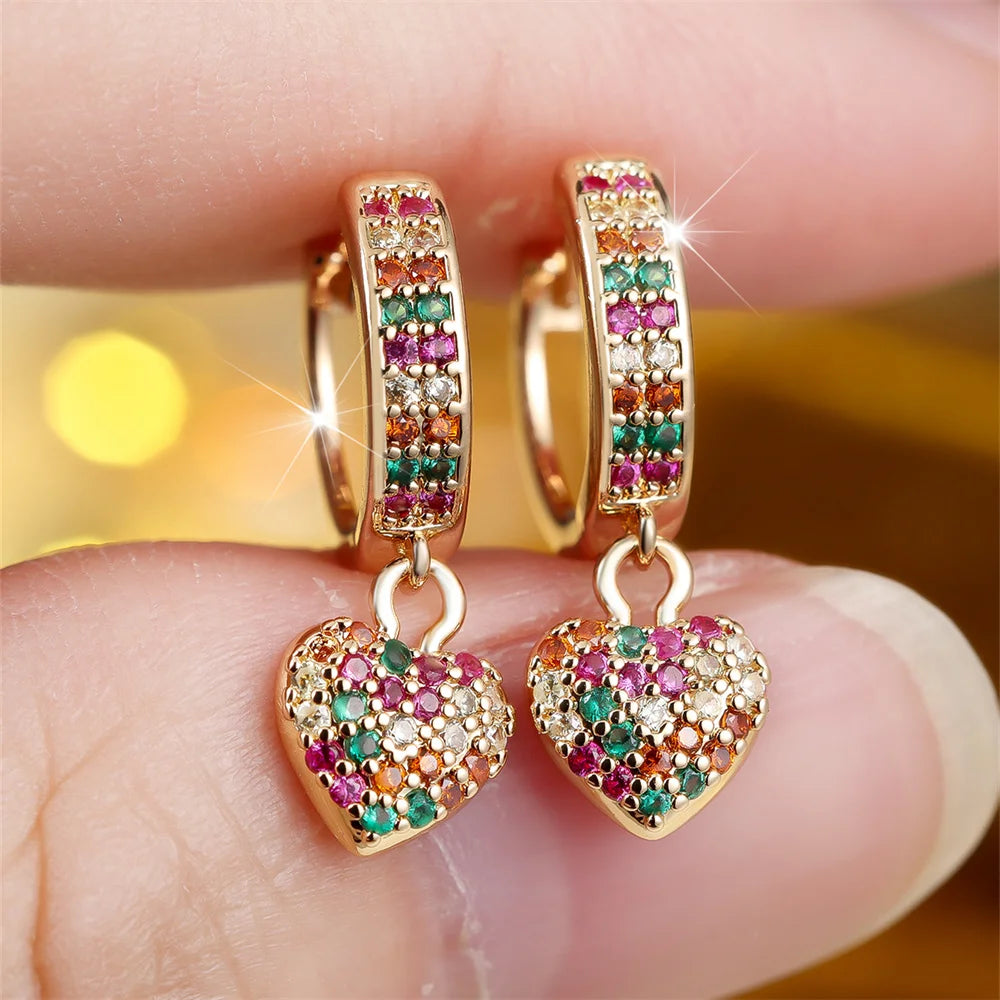Gold plated heart hoop earrings with rainbow zircon crystals, showcasing sparkling crystal jewelry design.