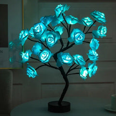 A decorative rose tree lamp with glowing blue LED flowers on adjustable branches.