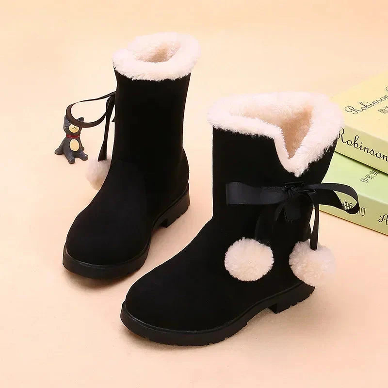 Girls' winter snow boots by SHOWLU FASHION STORE, suede mid-calf fur-lined boots with bowtie detail for warmth and style.