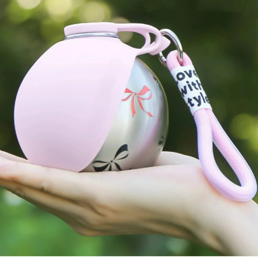 Showlu 2-in-1 portable dog water bottle with stainless steel leak-proof cup, ideal for outdoor dog hydration.