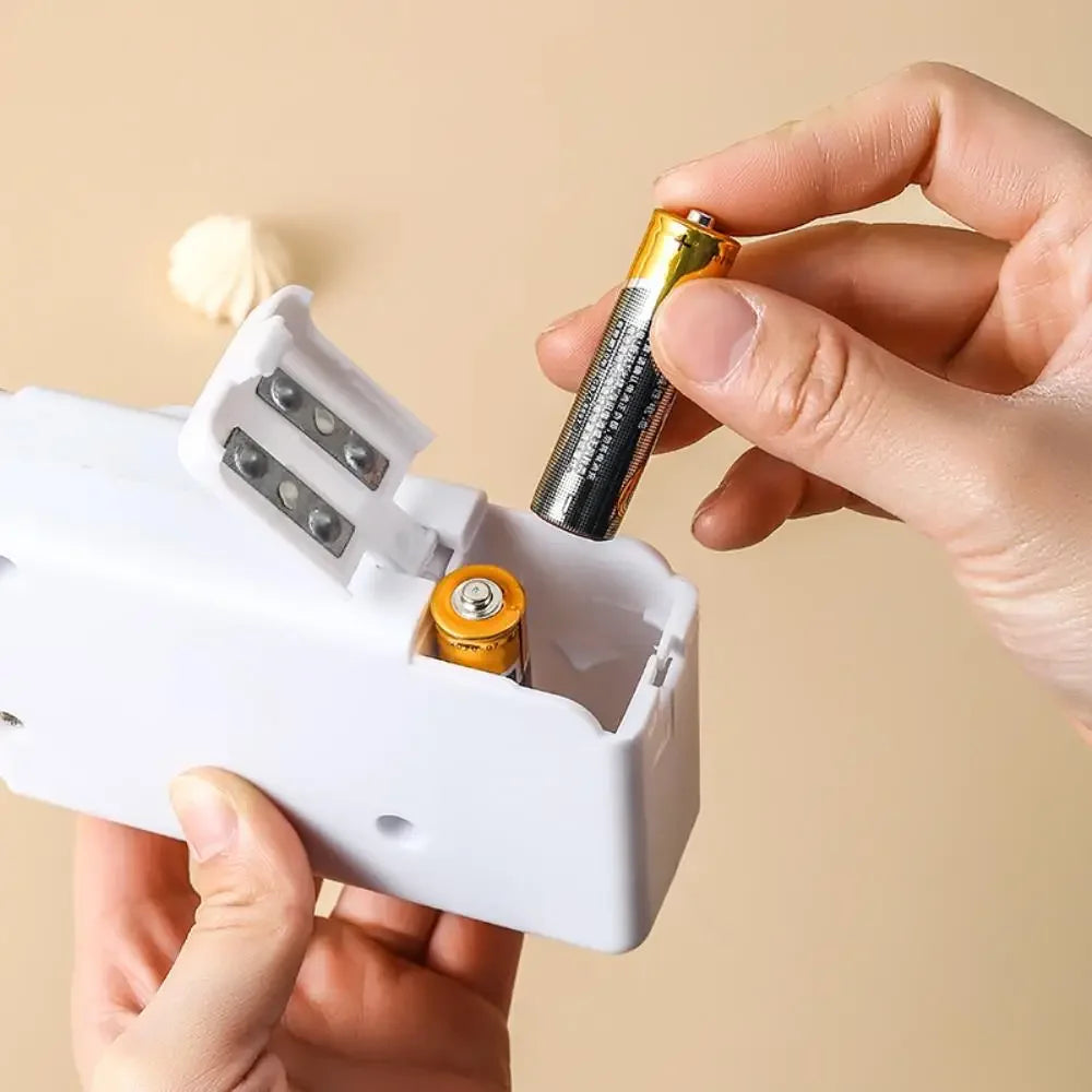 Showlu Smart General Mini Handheld Sewing Machine with compact design and control knob for easy sewing and repairs.