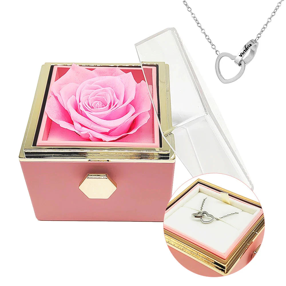 Engraved interlocking heart necklace with eternal rose in a decorative box from Showlu Fashion Store, displayed on a jewelry stand.