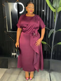 Elegant plus size African Dashiki Ankara gown featuring vibrant patterns and long flowing design, perfect for cultural celebrations.
