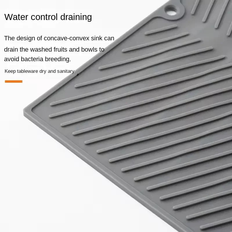 Showlu Smart General silicone sink protector mat with raised edges and drainage holes for preventing scratches and debris in the kitchen sink.