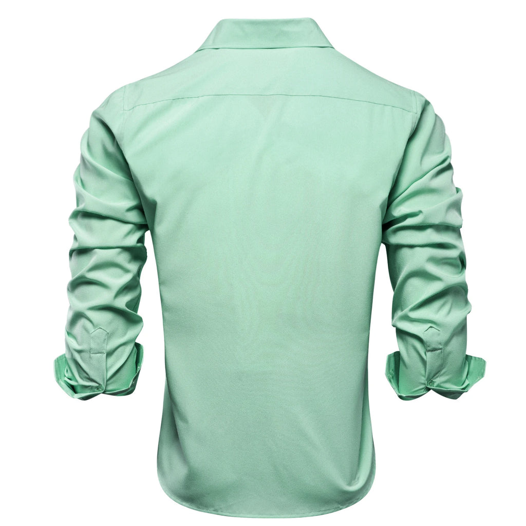 Blue silk men's long sleeve dress shirt with lapel collar, suitable for business, wedding, or formal occasions.