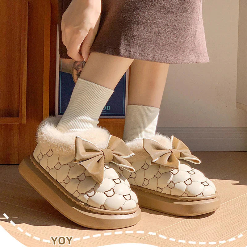 Rimocy women's fluffy butterfly platform ankle snow boots with cozy fur lining and sturdy soles for winter wear.