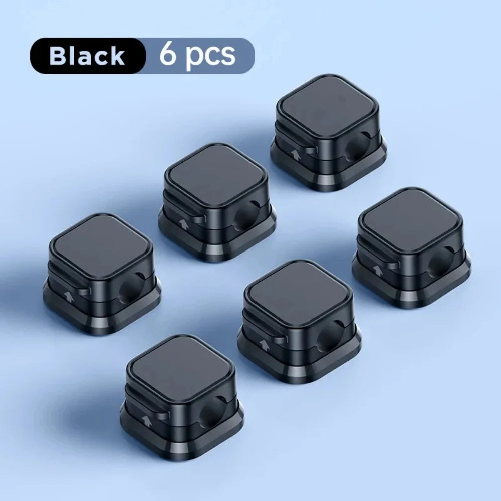 Showlu Smart General magnetic cable clips organizer holding and securing wires on a desk for neat cable management.