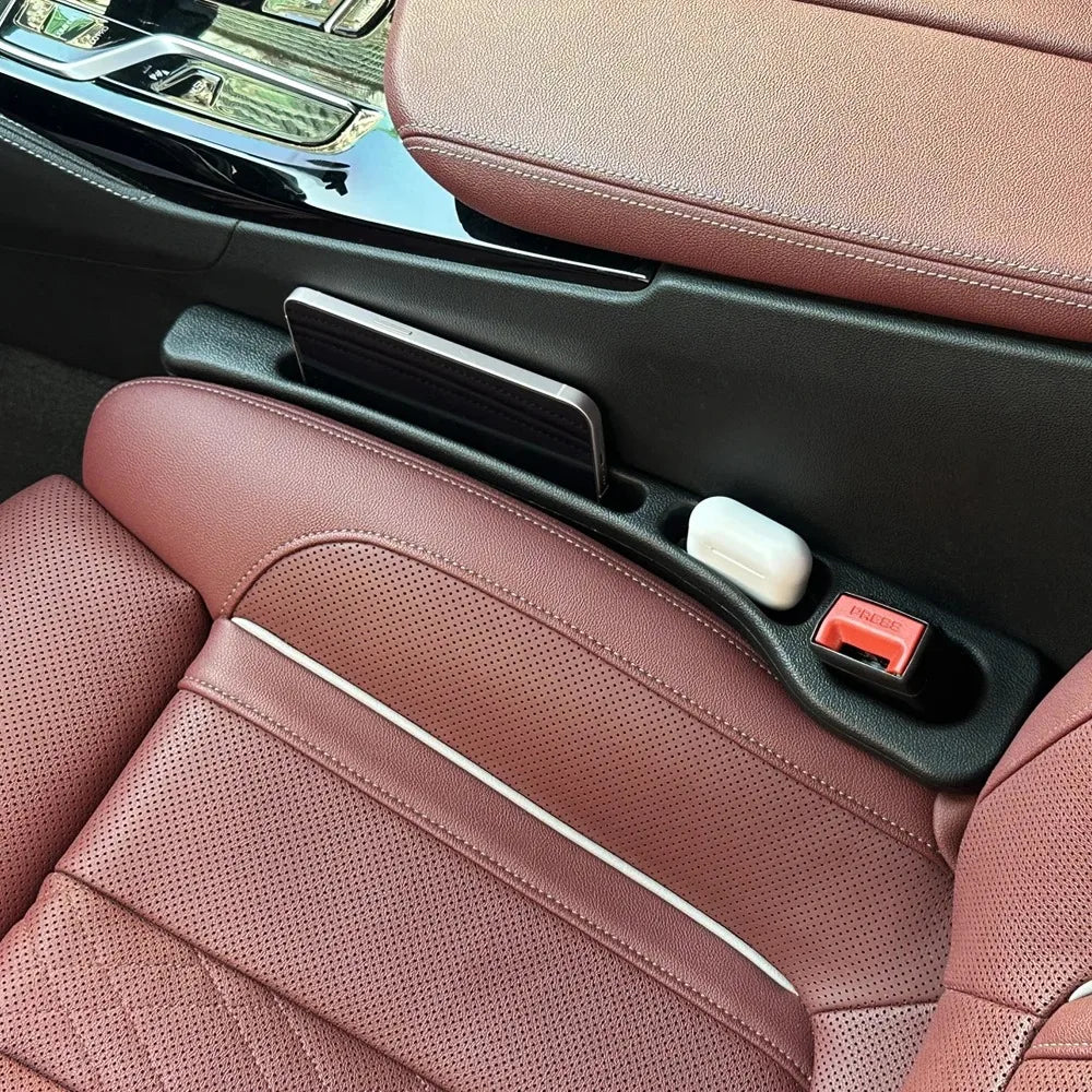 Showlu Smart General car seat gap organizer showing multiple compartments for storing keys, phones, and small items between car seats.