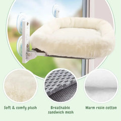 A plush cat hammock with suction cups for mounting on a window.