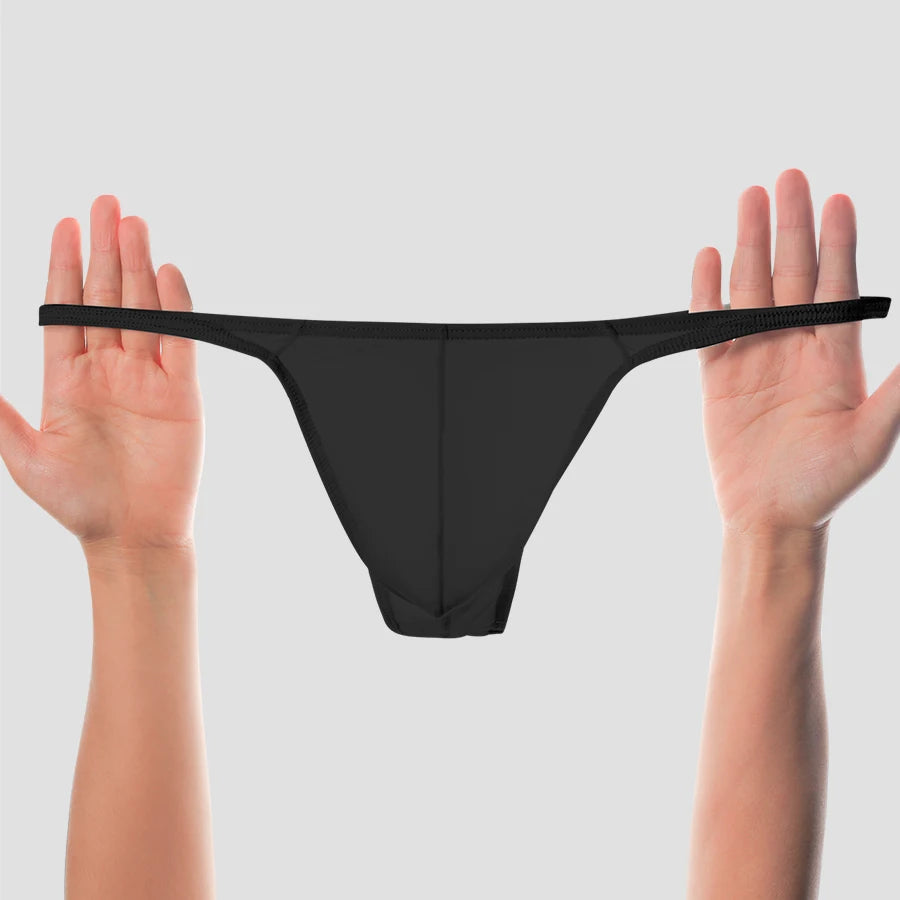 Showlu men's low-rise solid thong underwear made of breathable, stretchy nylon fabric, designed for comfortable fit and support.